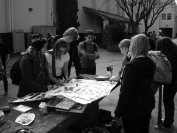 Members of the GSA club put their "hurtful" labels on a poster to later symbolically destroy.