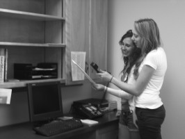 Leadership students Mandy Matthews and Rachel Roskelly utilize the new intercom system during second period.