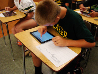 CJ Kannady, freshman, uses one o fthe iPads that the Placer science department provided for the first time.