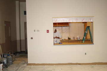 Maintenance workers renovating new snack bar on the dance floor